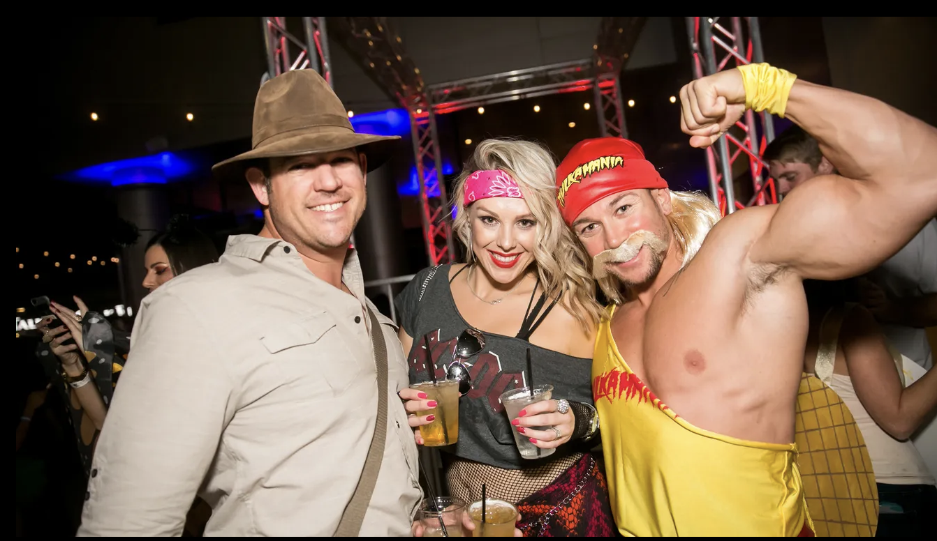 Costumed guests at a Single And The City Halloween singles party